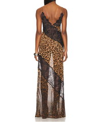 Woman wearing a leopard print and lace dress on a white background