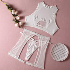 White lingerie set with mesh details on a pink background