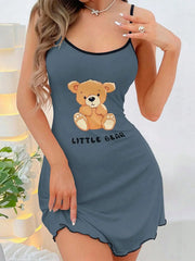 Blue nightgown with a teddy bear design and 'Little Bear' text, worn by a model.