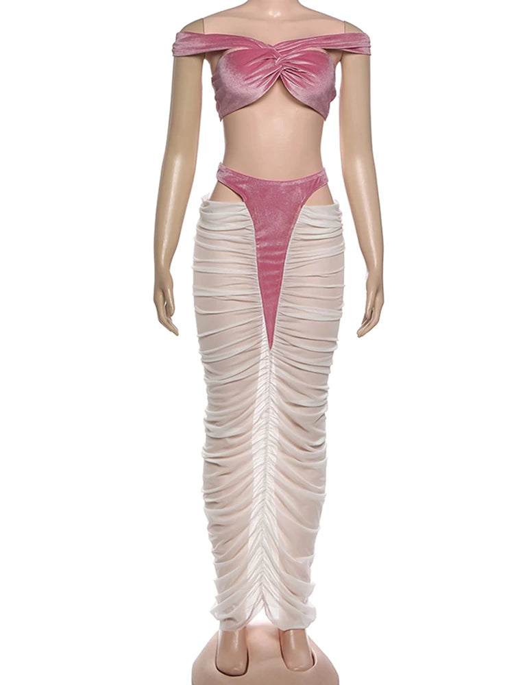 Mannequin wearing a pink top and beige skirt on a white background