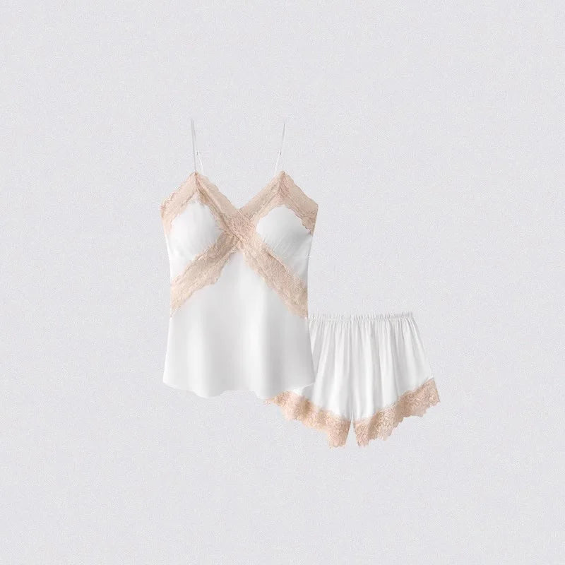 White nightgown with beige lace trim on a light gray background