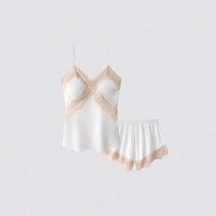 White nightgown with beige lace trim on a light gray background