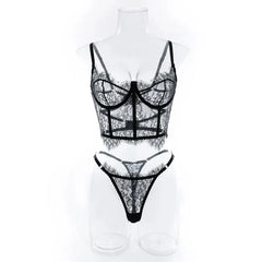Black lace lingerie set on a mannequin against a white background