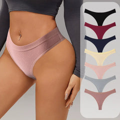 Woman wearing pink high-waisted bikini bottom with color swatches on a gray background