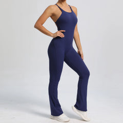 Person wearing a blue jumpsuit on a light gray background