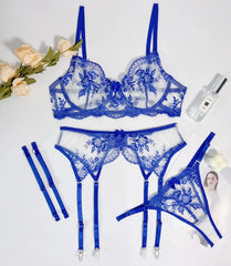 Blue lace lingerie set with floral designs on a white background.