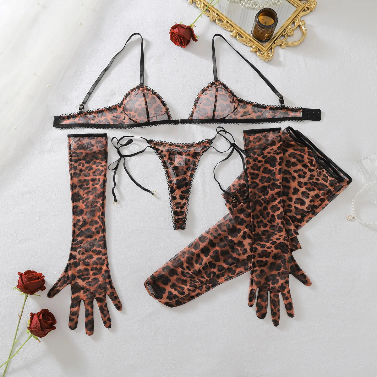 Flat lay of a leopard-print bra and tie-side thong with matching long gloves