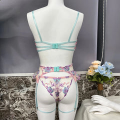 Mannequin wearing a floral lingerie set with a decorative background