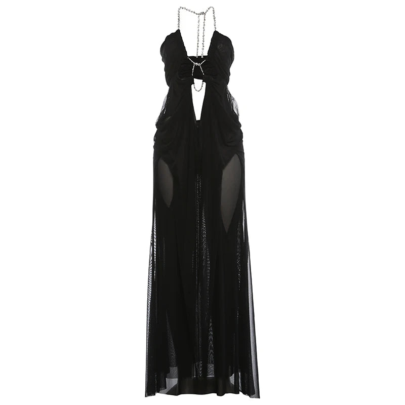 Black evening gown with sheer panels on a white background