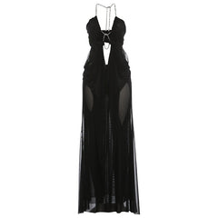 Black evening gown with sheer panels on a white background