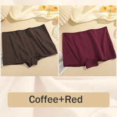 Two pairs of underwear in coffee and red on a beige fabric background.