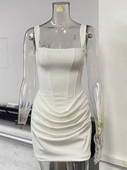 White dress on a transparent mannequin against a plain background