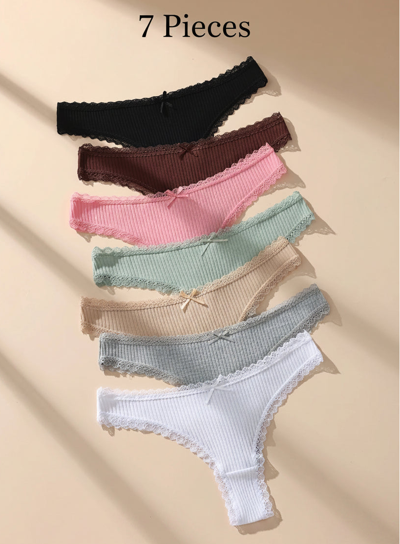 Set of colorful women's underwear on a beige background