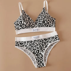 Leopard print bra and panties set on a beige background