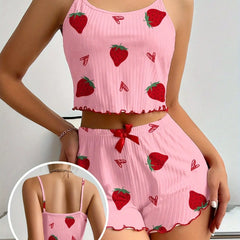 Pink pajama set with strawberry pattern on a plain background