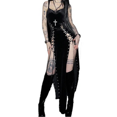 Person wearing a black gothic outfit with tattoos on a white background