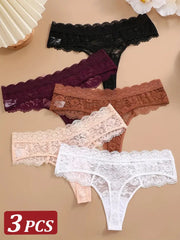 Set of three lace underwear pieces in black, brown, and white on a beige background.