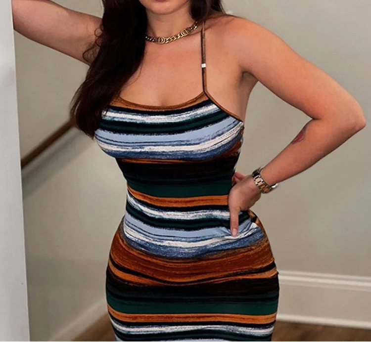 Woman wearing a striped dress posing indoors with 'kliou' branding.