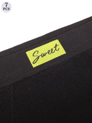 Black fabric with a yellow 'Sweet' label on a white background