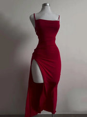 Red dress on a mannequin against a plain background