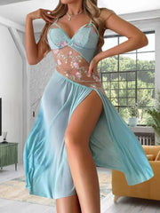Woman wearing a light blue lace nightgown in a room with a couch and window.