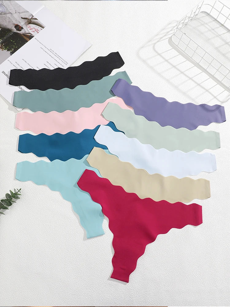Set of colorful scalloped headbands on a white surface