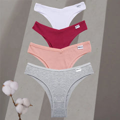 Four pairs of underwear in white, red, pink, and gray on a neutral background with cotton branches.