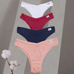 Four pairs of women's underwear in white, red, blue, and pink on a gray background with cotton branches.