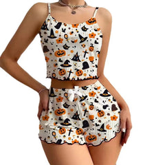 Two-piece Halloween-themed outfit with pumpkins, ghosts, and witches' hats on a white background.