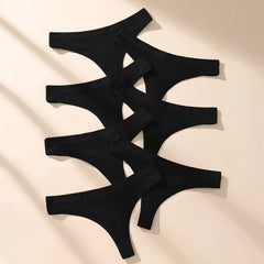 7 black thong-style underwear on a beige fabric background 0