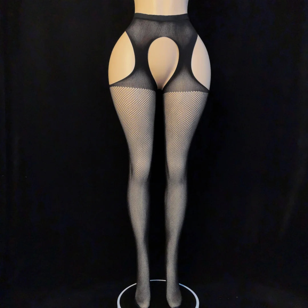Black fishnet stockings on a mannequin against a black background