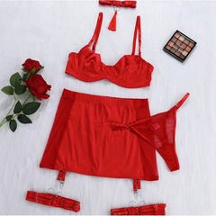Red lingerie set with a rose and makeup palette on a white background