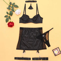 Black lingerie set with a yellow background, including a bra, skirt, and garter belt.