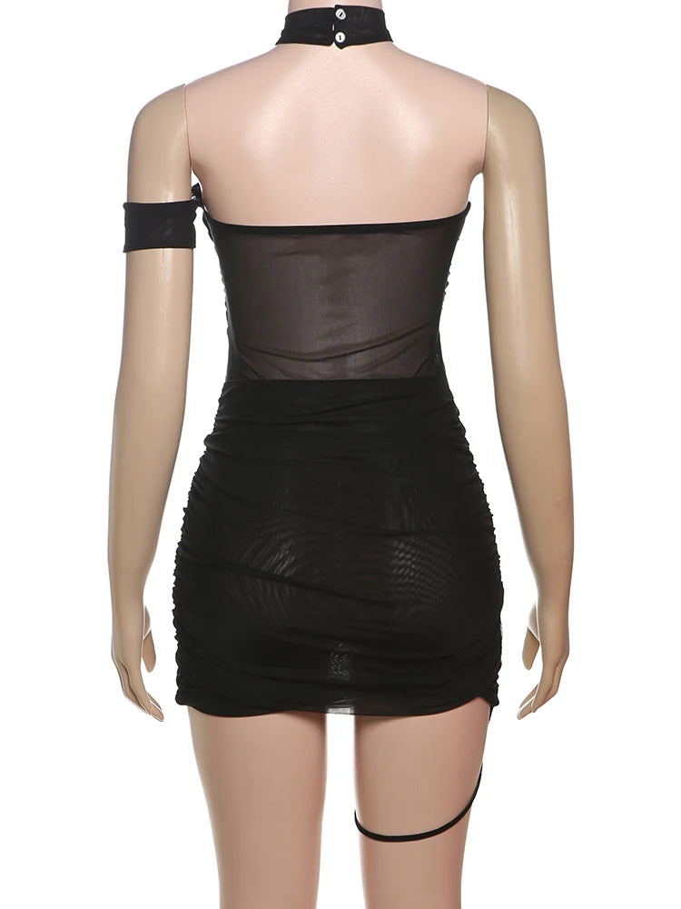Black dress with sheer overlay on a mannequin against a white background