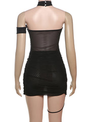 Black dress with sheer overlay on a mannequin against a white background