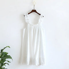 White dress on a hanger against a white background