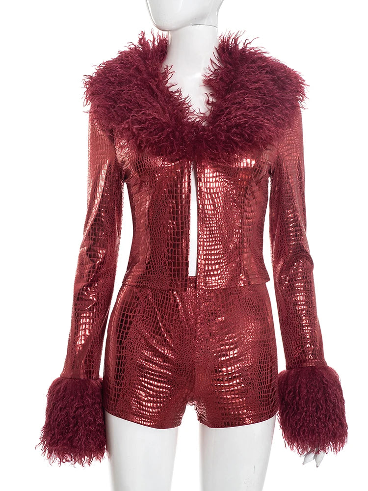 Red metallic jumpsuit with feathered collar and cuffs on a mannequin against a white background