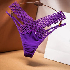 Purple bikini bottom with mesh design on a neutral background