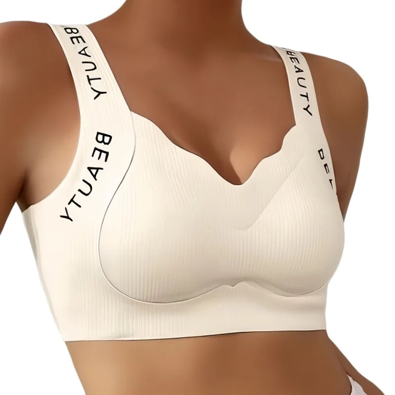 Beige bra with 'BEAUTY DELITE' branding on straps against a white background