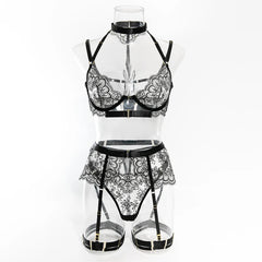 Black lace lingerie set on a clear mannequin against a white background