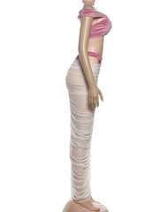 Mannequin wearing a pink top and beige skirt on a white background