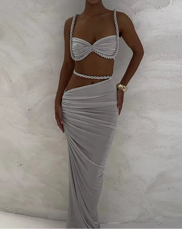 Woman wearing a gray dress with a textured background