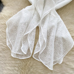 White lace fabric on a fur surface