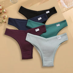 Set of men's underwear in various colors on a beige background