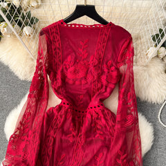 Red lace dress on a hanger with decorative background
