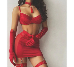 A woman wearing a black mesh see-through lingerie set with a bra and attached garter straps, paired with a matching skirt.