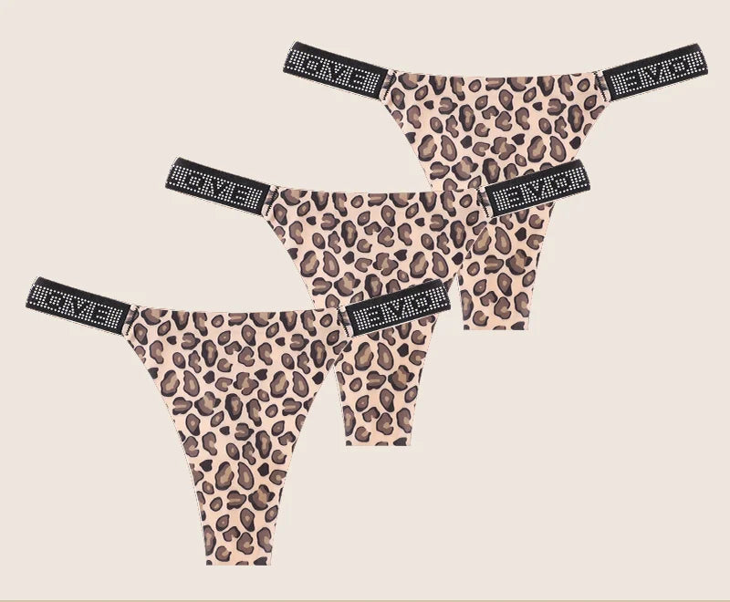 Leopard print panties with rhinestone accents on a beige background