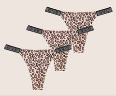 Leopard print panties with rhinestone accents on a beige background