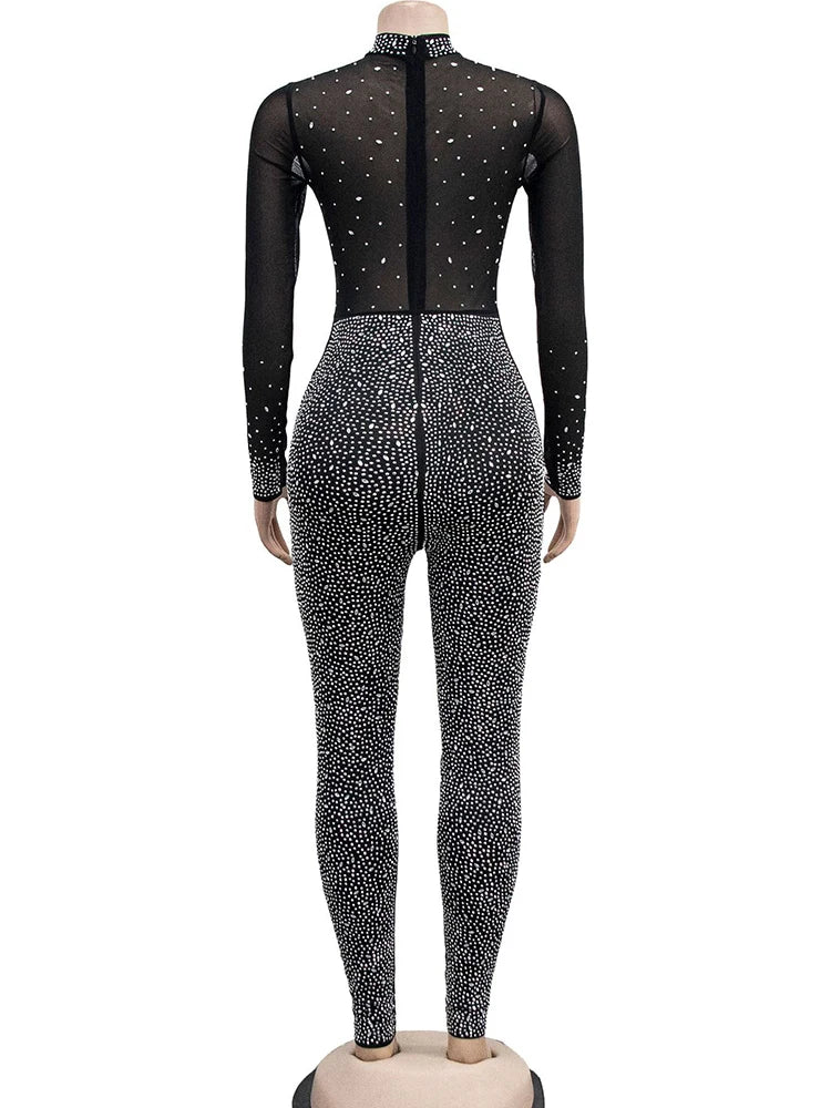 Black bodysuit with silver sequins on a white background