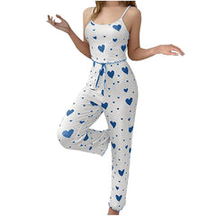White romper with blue heart patterns on a white background